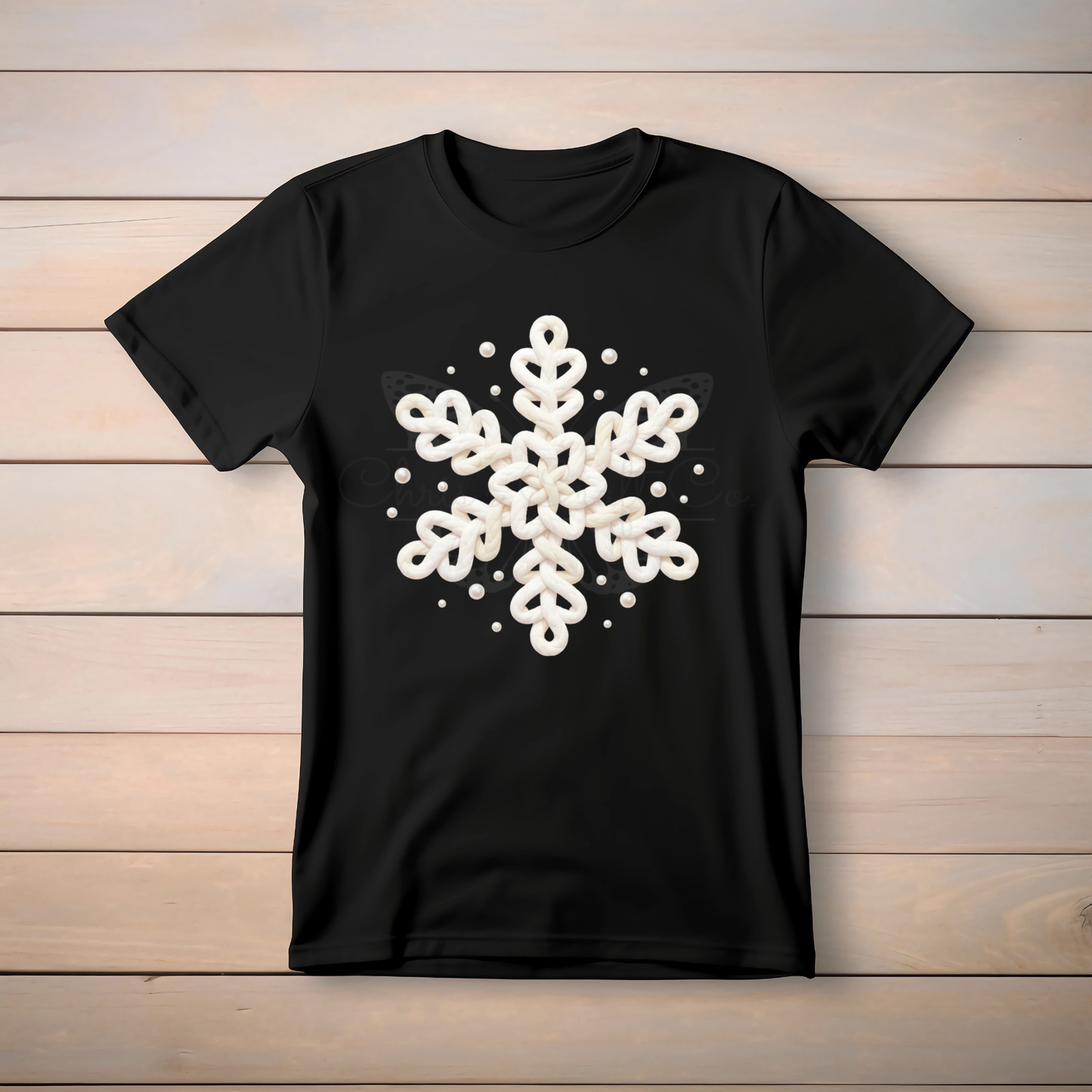 Ready-to-press DTF transfer featuring faux yarn snowflake, printed on clear film for heat application.