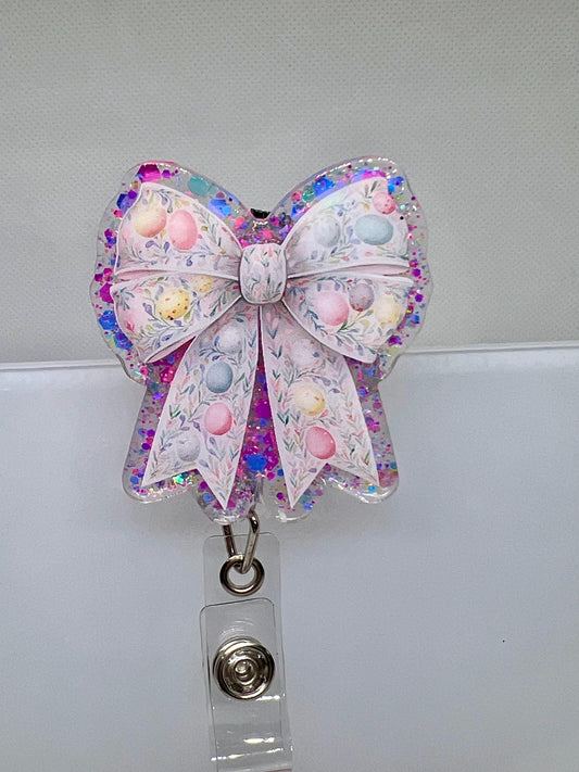 Glittery Easter Bow Badge Reel – Pastel Egg and Floral Design for Nurses, Teachers, and Professionals