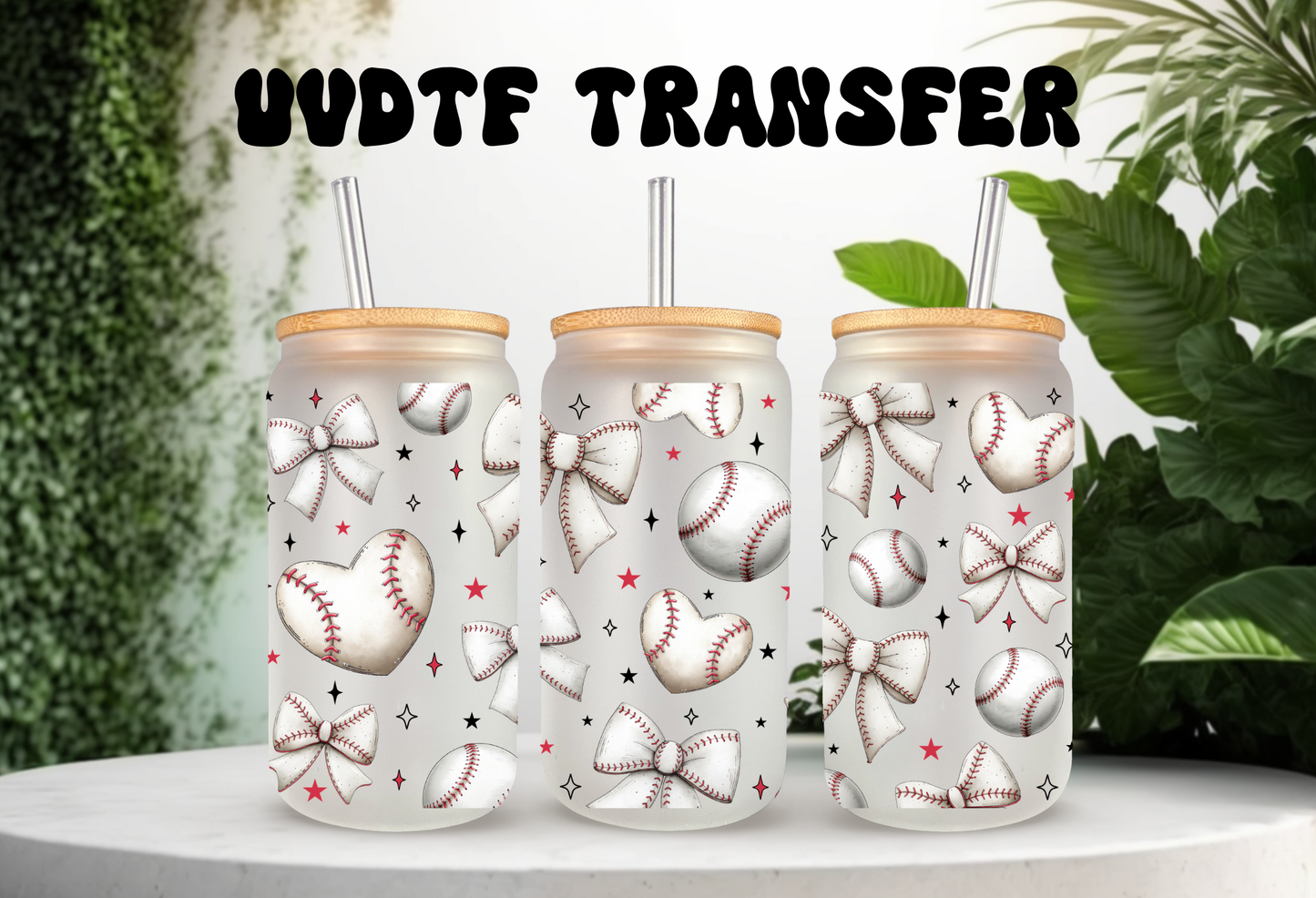 Mockup of three frosted 16oz glass cans featuring a white coquette bow and baseball pattern UVDTF wrap, styled with bamboo lids and glass straws.