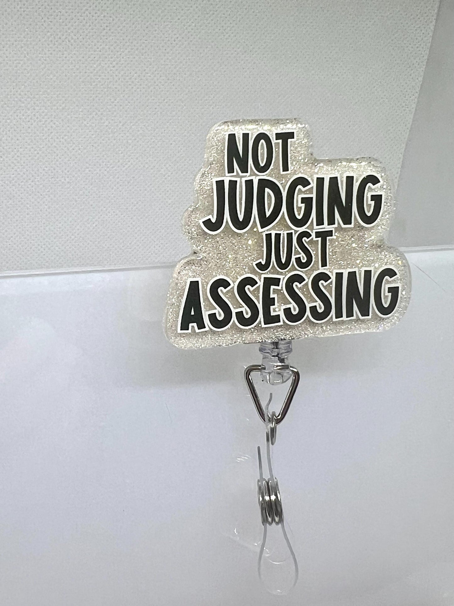 Funny Glitter Badge Reel – 'Not Judging, Just Assessing' Cloud Design with Retractable ID Holder