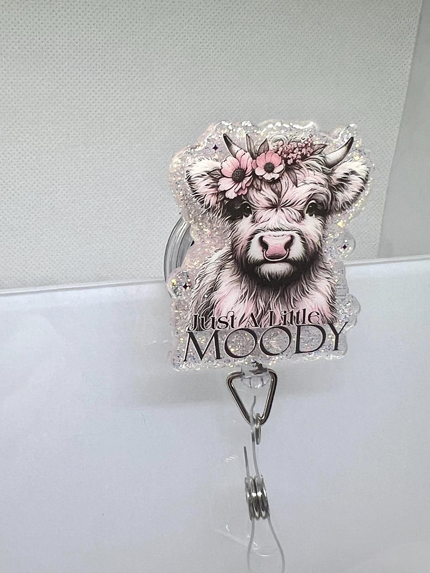 Funny Highland Cow Badge Reel – 'Just a Little Moody' Floral Glitter Design for Work Accessories