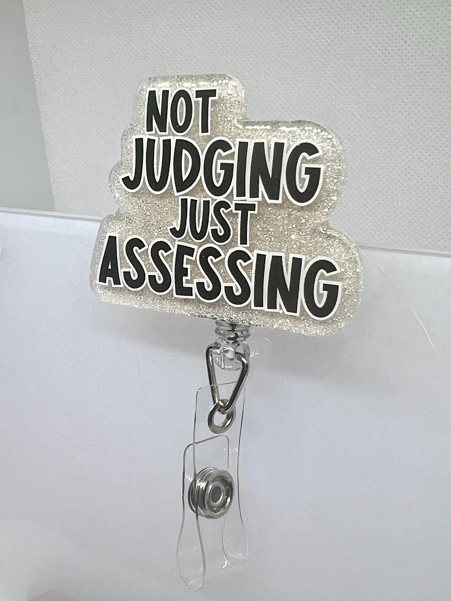 Funny Glitter Badge Reel – 'Not Judging, Just Assessing' Cloud Design with Retractable ID Holder