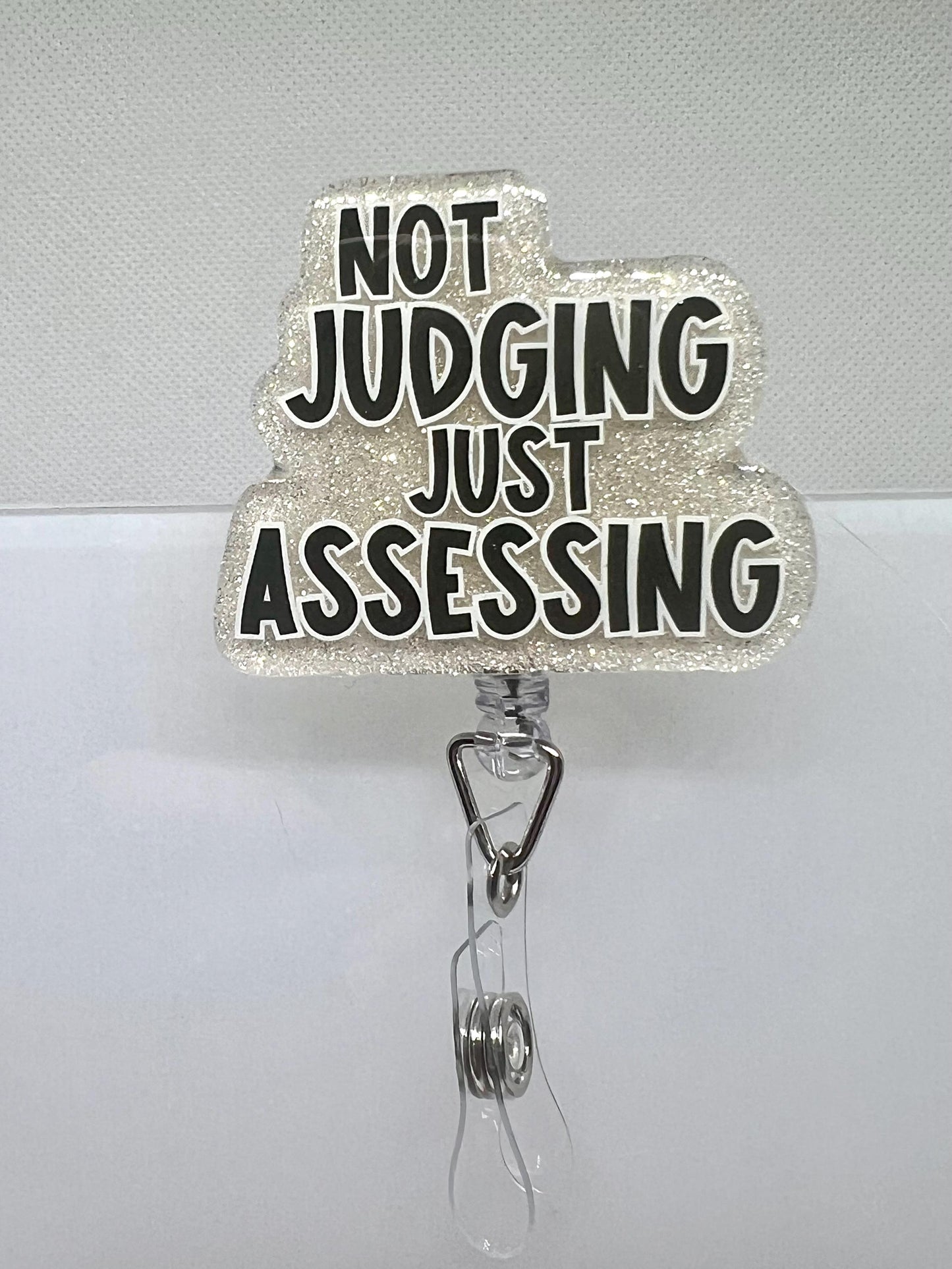 Funny Glitter Badge Reel – 'Not Judging, Just Assessing' Cloud Design with Retractable ID Holder