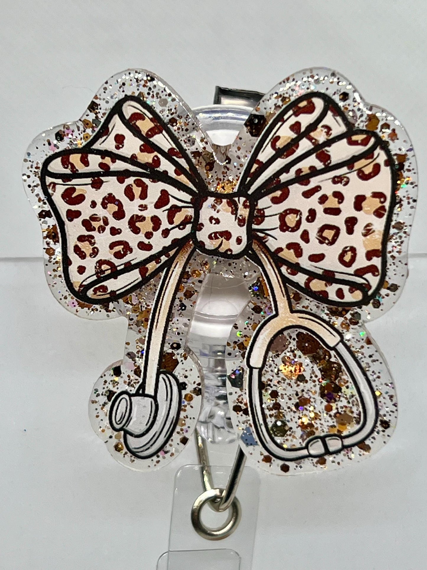 Leopard Print Coquette Bow Badge Reel with Stethoscope Charm –Glitter Acrylic Design for Nurses and Medical Professionals