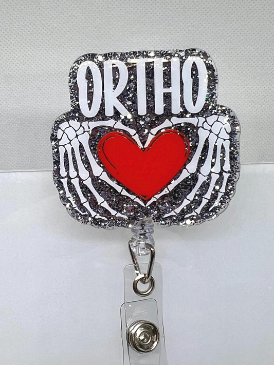 Glittery Orthopedic Badge Reel – Skeletal Hands Forming a Heart with 'ORTHO' Design, Perfect for Nurses, Doctors, and Medical Professionals