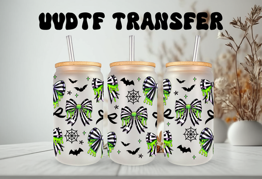 Spooky coquette UV DTF wrap featuring neon green slime drips, black and green spiderweb bows, bats, and cobwebs for 16oz glass can tumblers.