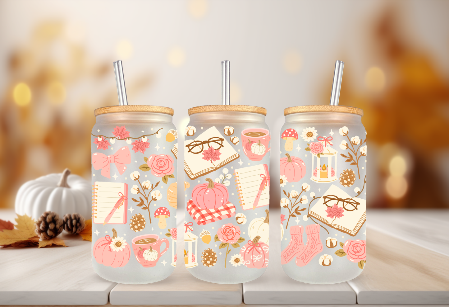 Cozy pink bookish autumn UV DTF wrap featuring reading glasses, open books, pink pumpkins, coffee mugs, and autumn foliage for 16oz glass can tumblers.