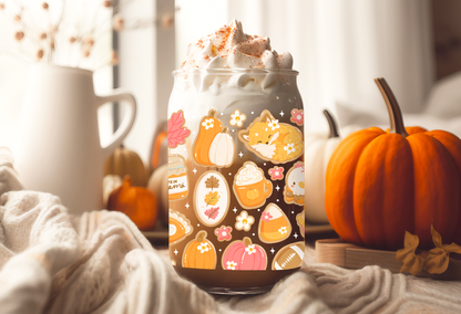 16oz can glass wrap featuring a cozy fall aesthetic design with sleeping foxes, pumpkin spice lattes, pumpkin jam jars, and pie slices on a clear background.