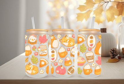 16oz can glass wrap featuring a cozy fall aesthetic design with sleeping foxes, pumpkin spice lattes, pumpkin jam jars, and pie slices on a clear background.