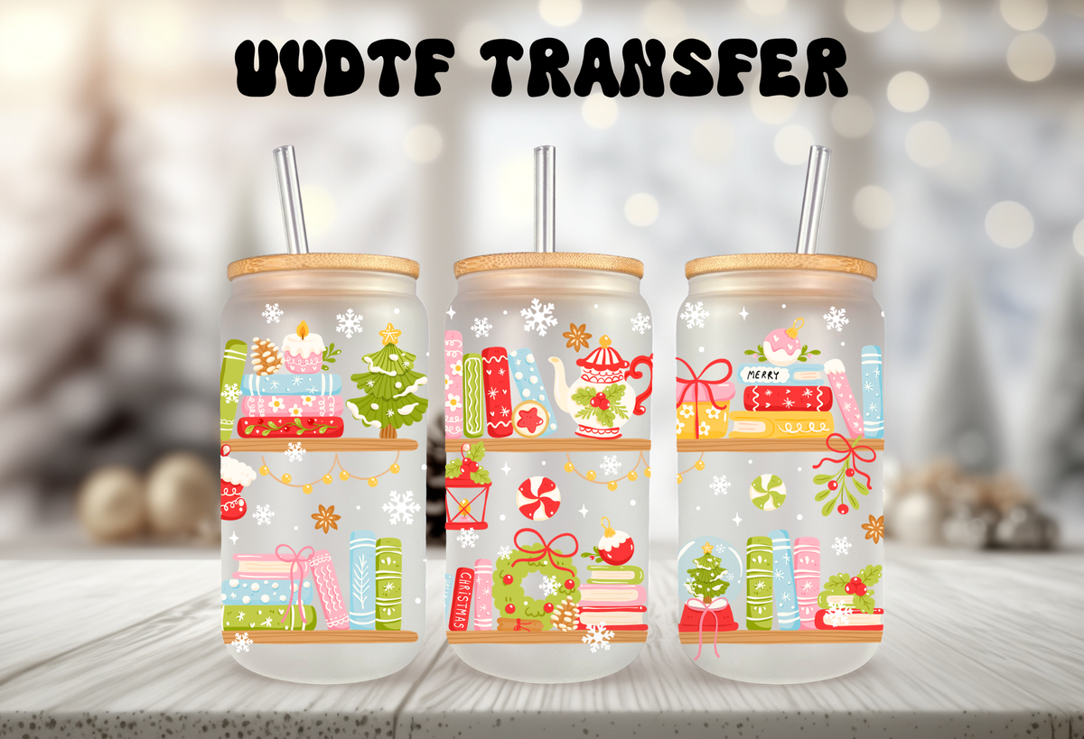 A MOCKUP OF three 16oz glass can tumblers with bamboo lids displaying Christmas books, cozy mugs, and holiday tree UVDTF wrap designs
