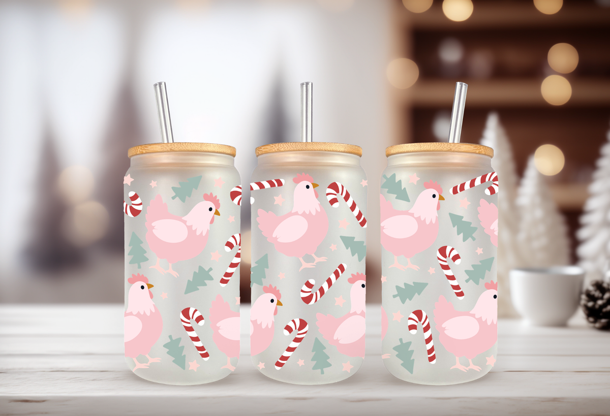 mockup of Three 16oz glass can tumblers with bamboo lids displaying pink Christmas chicken hen UVDTF wrap designs