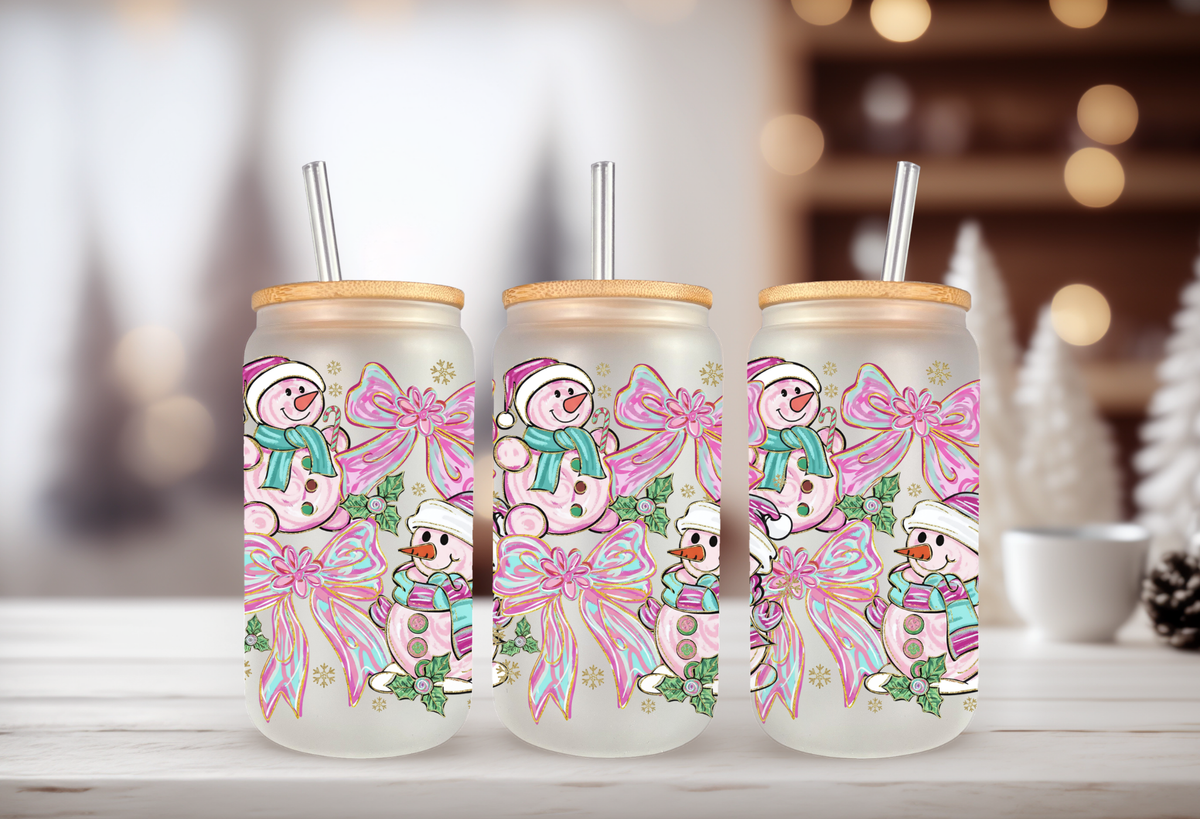 16oz glass can tumbler mockup featuring pink and teal snowman with coquette bow UVDTF transfers.