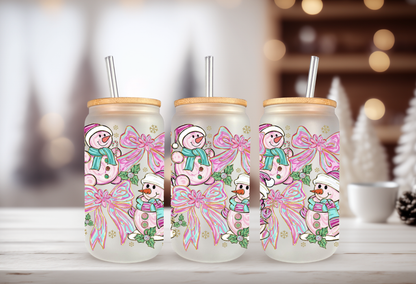 16oz glass can tumbler mockup featuring pink and teal snowman with coquette bow UVDTF transfers.