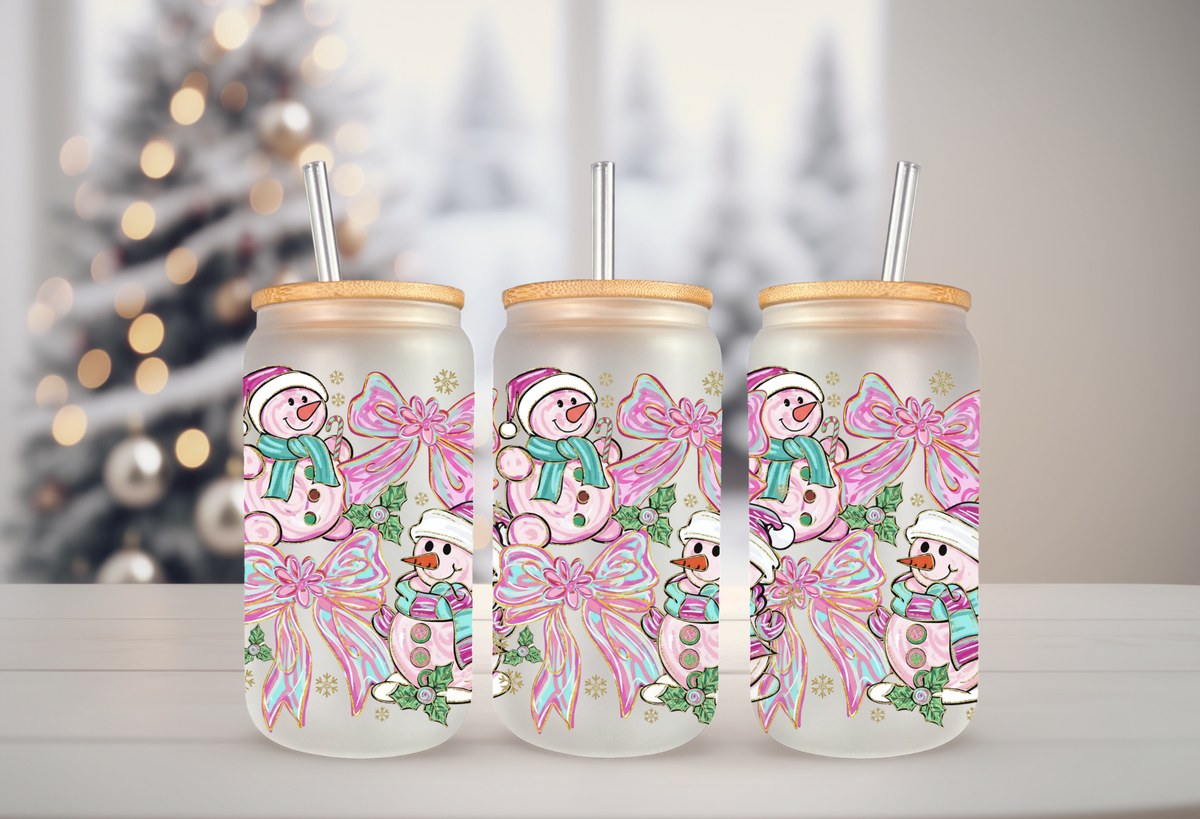 16oz glass can tumbler mockup featuring pink and teal snowman with coquette bow UVDTF transfers.