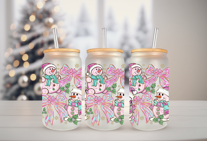 16oz glass can tumbler mockup featuring pink and teal snowman with coquette bow UVDTF transfers.