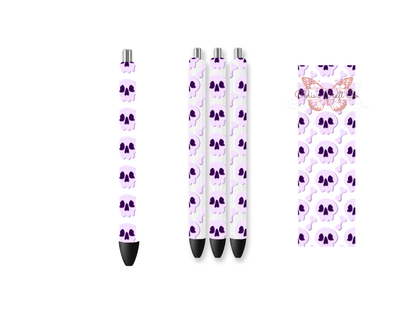 Pen wrap mockup featuring three white gel pens decorated with pastel purple skulls and bones UV DTF transfers.