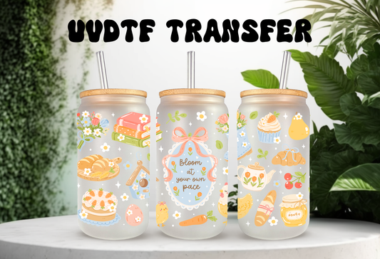 16oz can glass wrap featuring a pastel cottagecore design with a pink stand mixer, recipe books, a watering can, and a central frame reading Bloom at your own pace.
