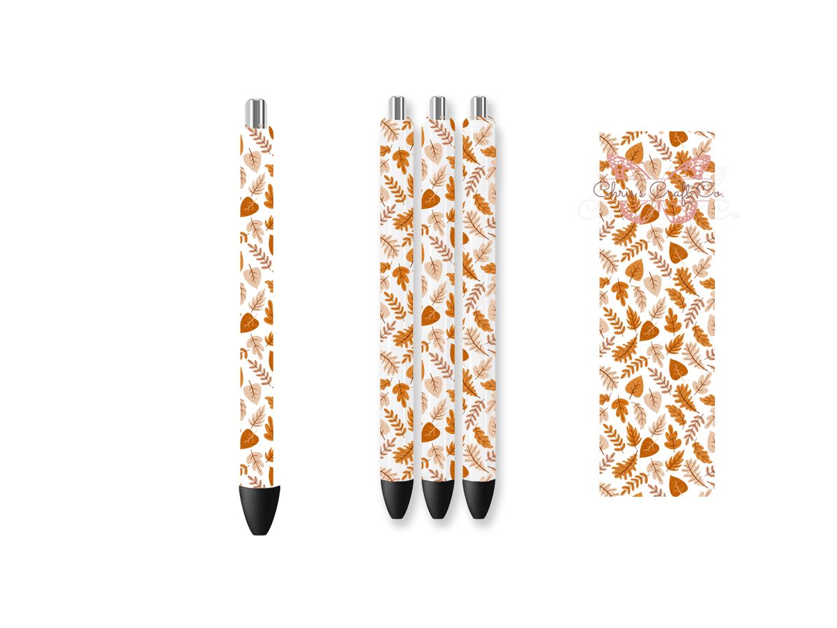 Pen wrap mockup featuring three white gel pens decorated with falling autumn leaves and maple foliage UV DTF transfers.