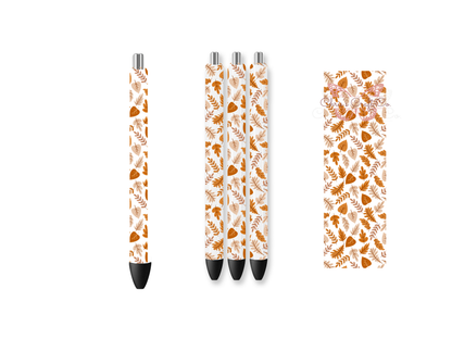 Pen wrap mockup featuring three white gel pens decorated with falling autumn leaves and maple foliage UV DTF transfers.