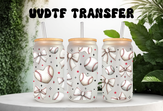 Mockup of three frosted 16oz glass cans featuring a white coquette bow and baseball pattern UVDTF wrap, styled with bamboo lids and glass straws.