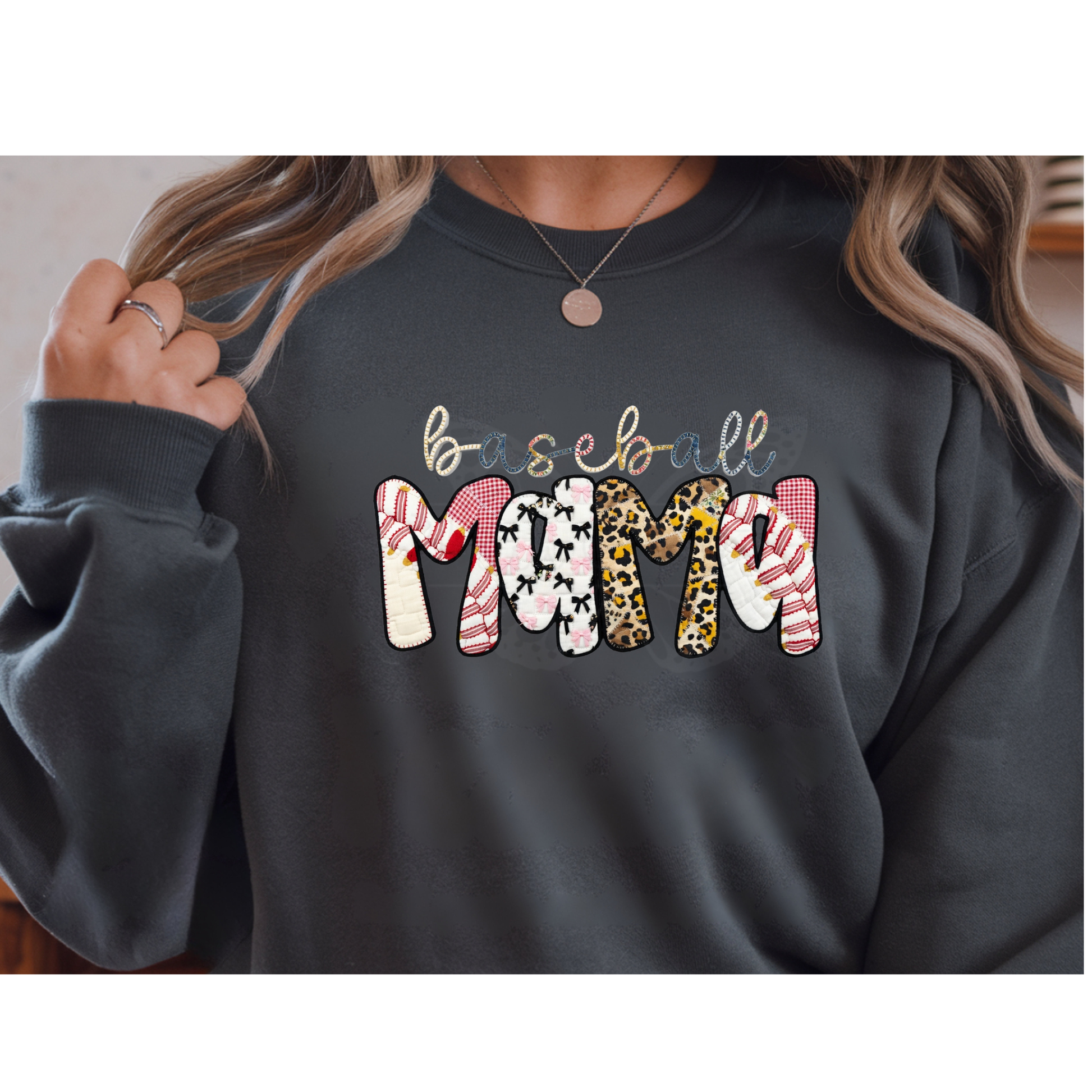 Ready to press DTF apparel transfer featuring 'baseball MAMA' in a faux applique style with leopard print, pink plaid, bows, and baseball stitches.

