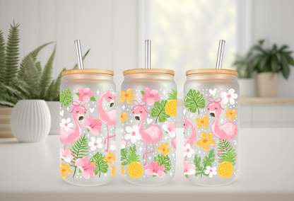16oz can glass wrap featuring pink flamingos with polka dot bows, tropical pineapples, pink hibiscus, and green palm leaves on a clear background.