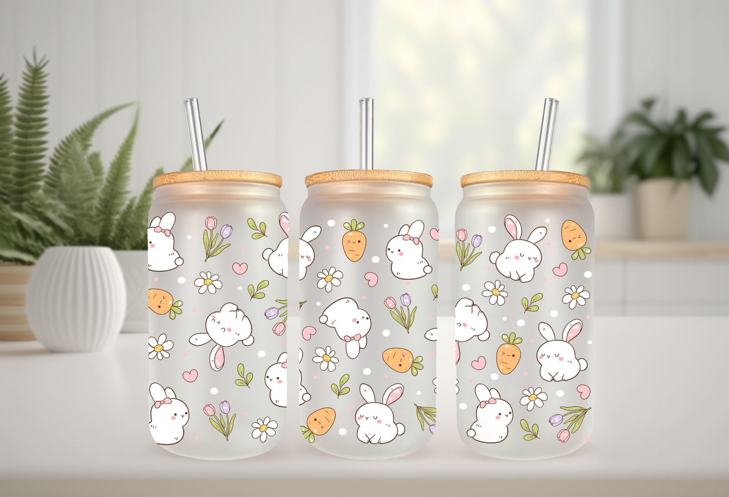 Product mockup of three 16oz glass cans featuring a Retro Bunny and Carrots UVDTF wrap with white bunnies, orange carrots, and spring flowers