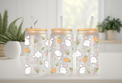 Product mockup of three 16oz glass cans featuring a Retro Bunny and Carrots UVDTF wrap with white bunnies, orange carrots, and spring flowers