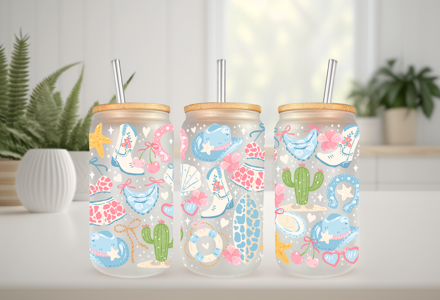 MOCKUP OF 16oz can glass wrap featuring white cowboy boots, a teal cowboy hat, cacti, starfishes, and seashells on a clear background.