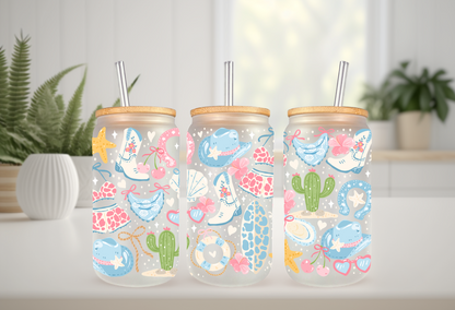 MOCKUP OF 16oz can glass wrap featuring white cowboy boots, a teal cowboy hat, cacti, starfishes, and seashells on a clear background.