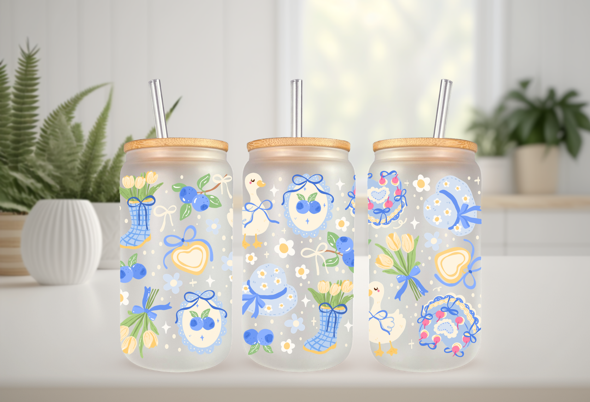 16oz can glass wrap featuring a pastel spring design with white porch geese wearing blue coquette bows mixed with yellow tulips and scattered blueberries.


