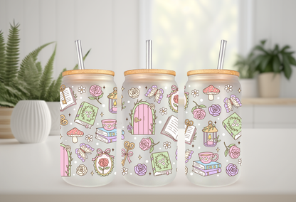 Mock-up of a Secret Garden Books UVDTF wrap for a 16oz can glass, featuring colorful book spines and pastel floral illustrations.