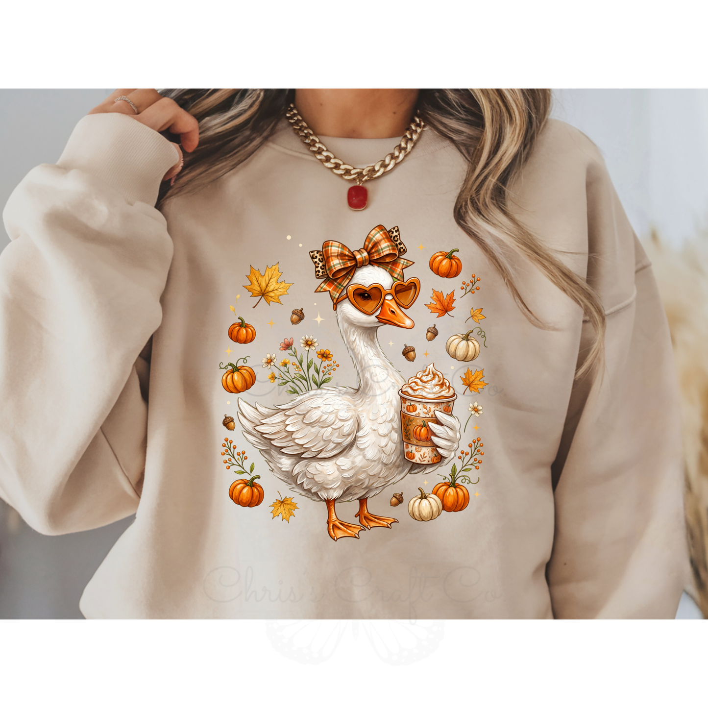 Ready to press DTF apparel transfer on a white t-shirt mockup featuring a white fall porch goose holding a pumpkin spice latte with autumn leaves