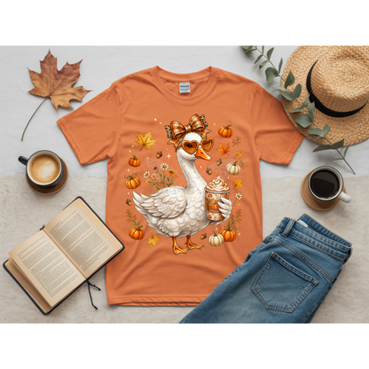 Ready to press DTF apparel transfer on a white t-shirt mockup featuring a white fall porch goose holding a pumpkin spice latte with autumn leaves