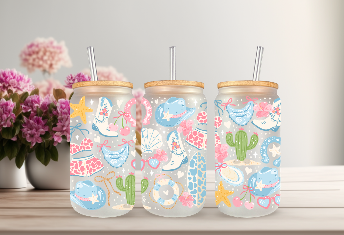 MOCKUP OF 16oz can glass wrap featuring white cowboy boots, a teal cowboy hat, cacti, starfishes, and seashells on a clear background.