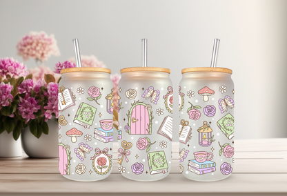 Mock-up of a Secret Garden Books UVDTF wrap for a 16oz can glass, featuring colorful book spines and pastel floral illustrations.