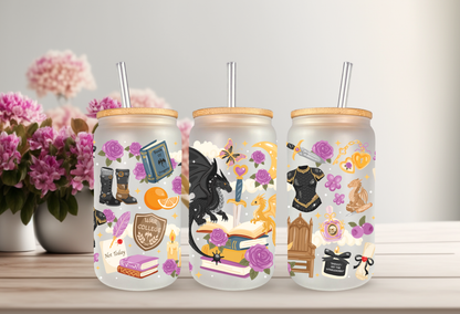 A mockup of three frosted 16oz glass cans with bamboo lids and straws, showcasing UV DTF transfers with bookish themes, dragons, and floral accents against a white background with green leaves