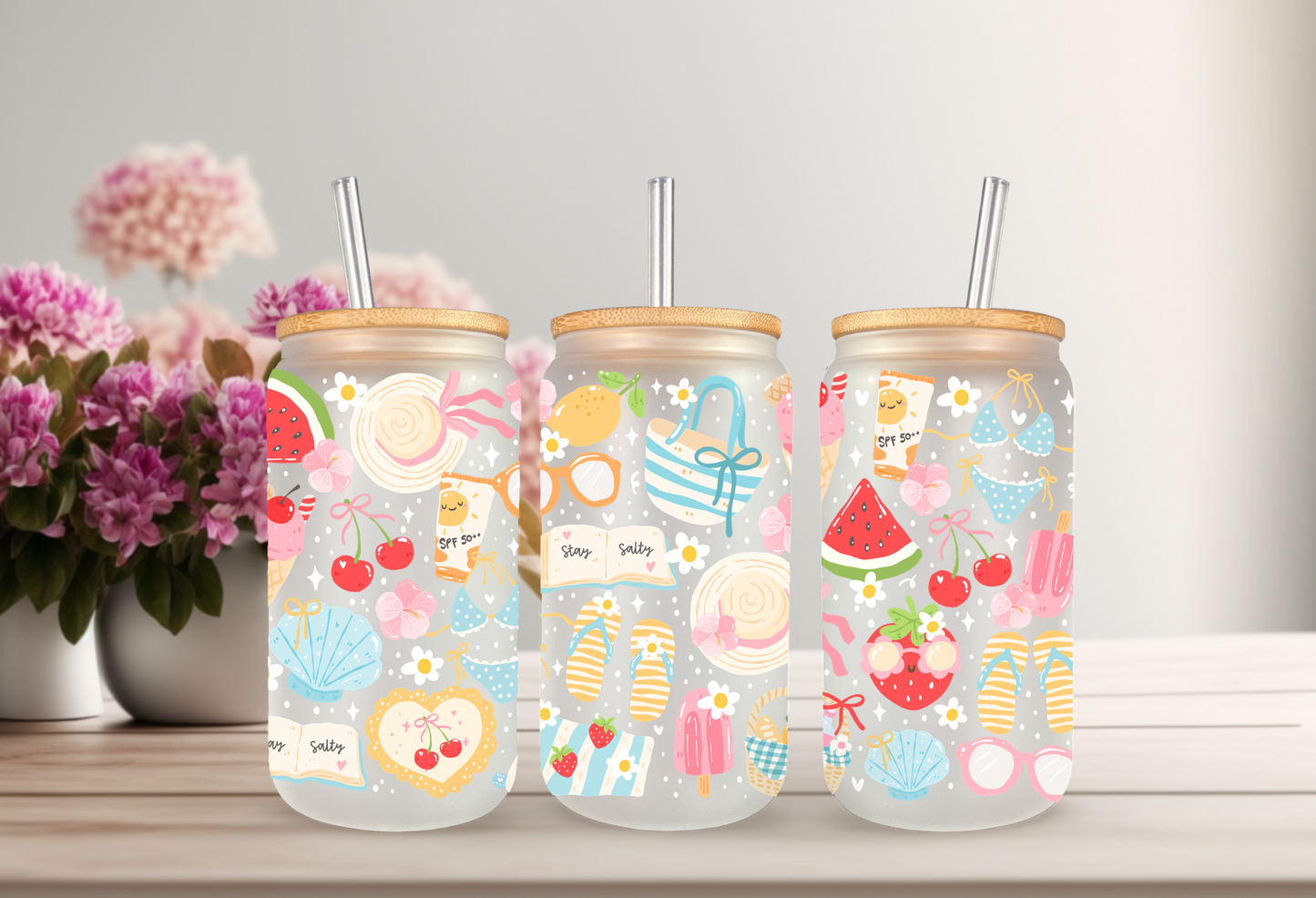 Mockup of a 16oz can glass wrap featuring retro summer elements including a Stay Salty motel key tag, sunglasses, smiling cherries, and flip flops on a clear background.