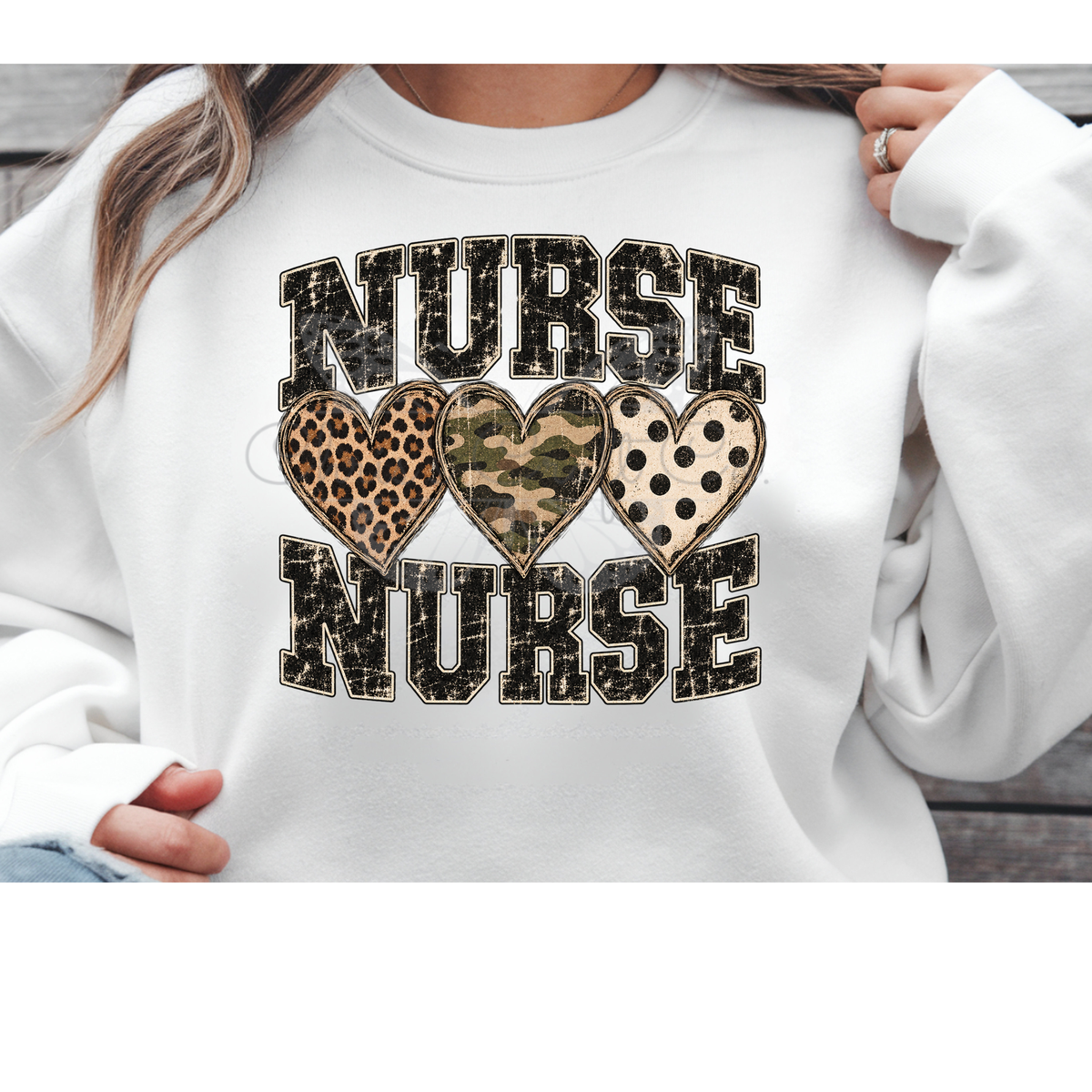 Sweatshirt mockup featuring a Nurse DTF transfer with leopard print, camo, and polka dot hearts