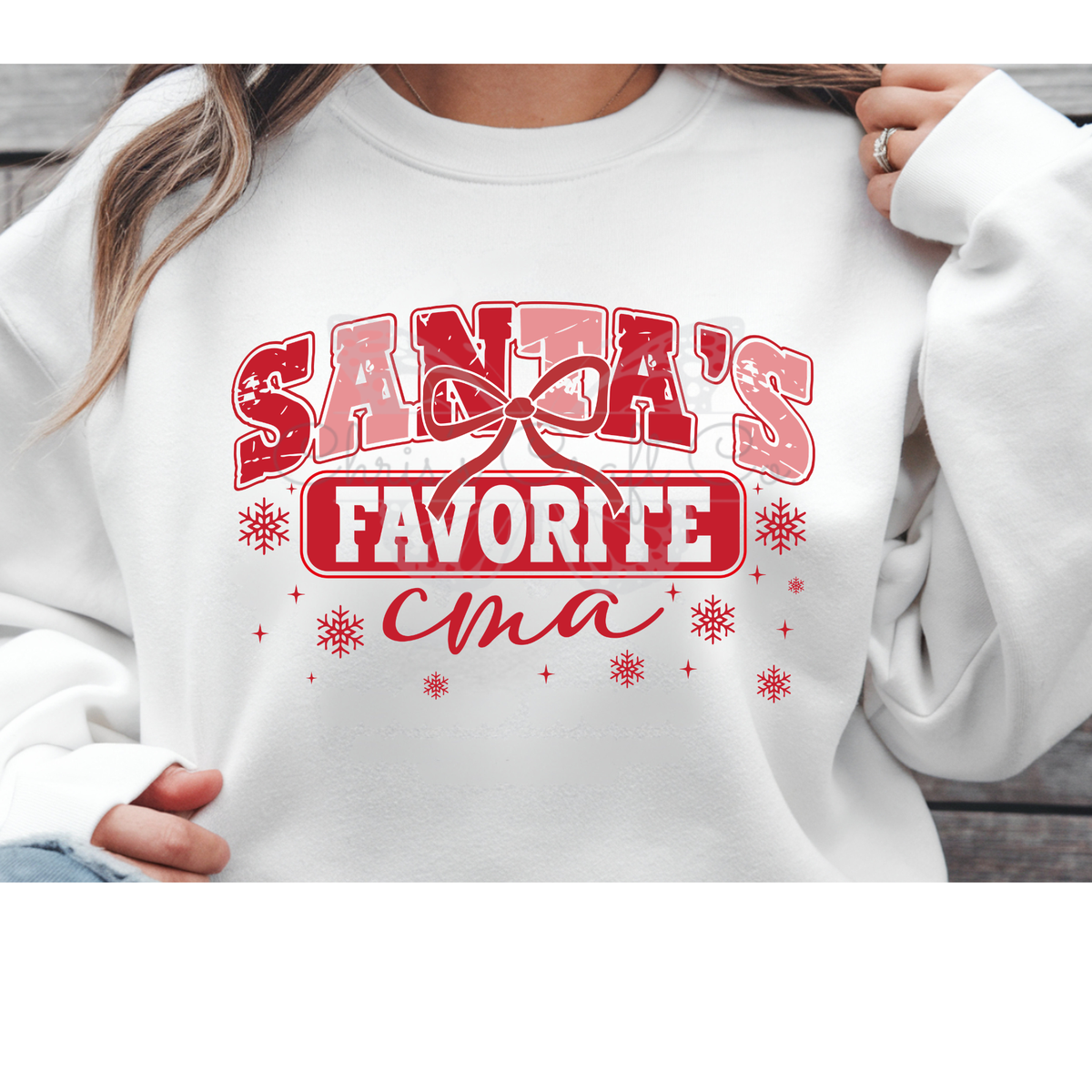 A MOCKUP OF a Santa's Favorite CMA Christmas DTF transfer pressed on a white crewneck sweatshirt