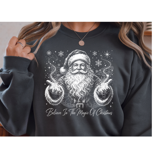 A MOCKUP OF a Believe In The Magic Of Christmas vintage Santa DTF transfer pressed on a dark sweatshirt