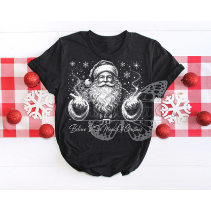 A MOCKUP OF a Believe In The Magic Of Christmas vintage Santa DTF transfer pressed on a dark sweatshirt