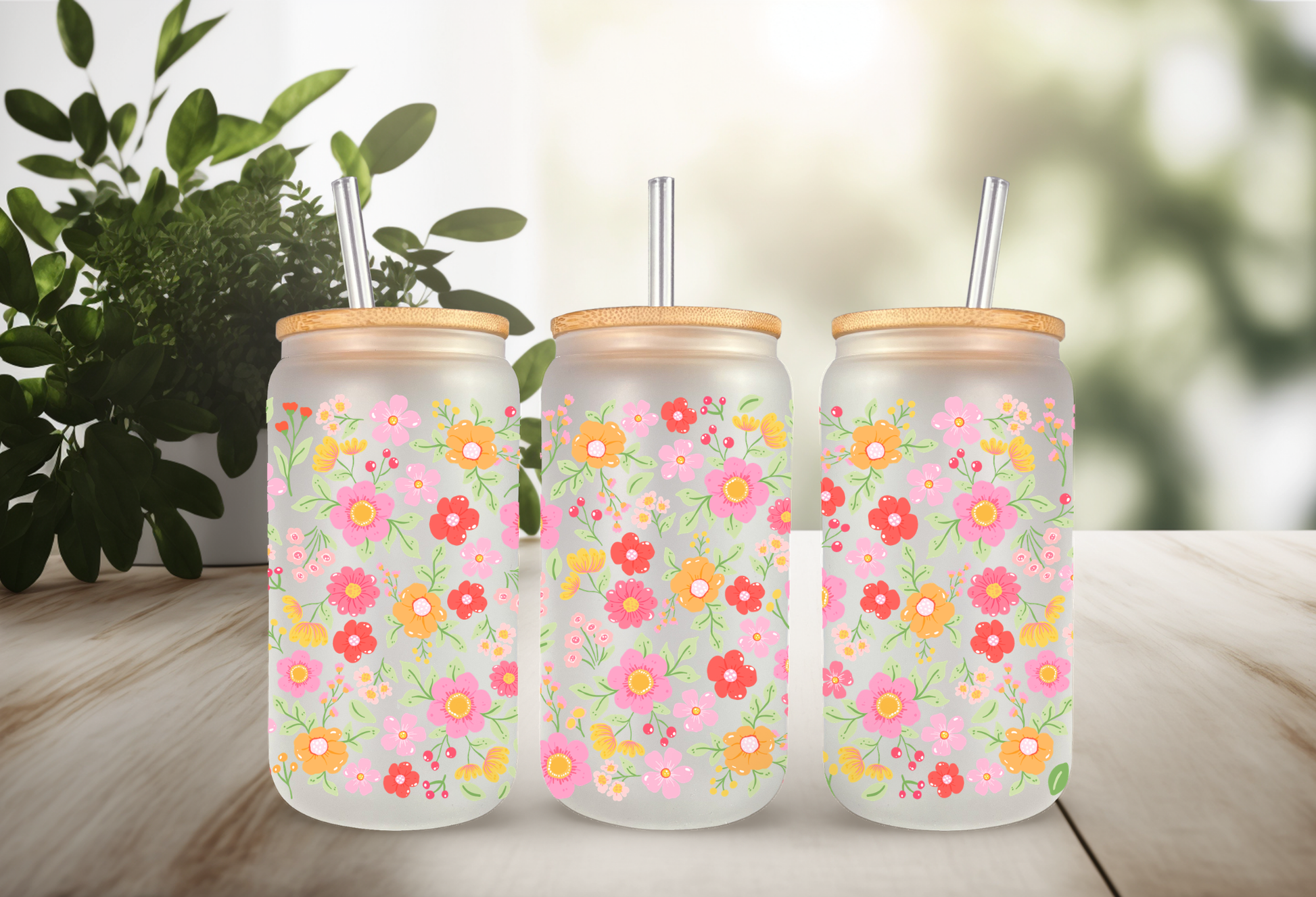 MOCKUP OF A 16oz frosted can glass wrap featuring a retro groovy floral design with bright pink, red, and yellow daisies on a clear background.