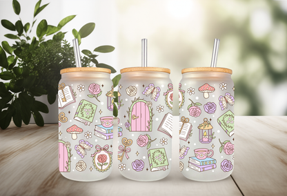 Mock-up of a Secret Garden Books UVDTF wrap for a 16oz can glass, featuring colorful book spines and pastel floral illustrations.