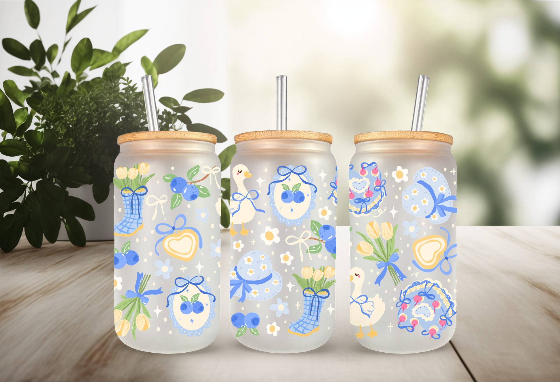 16oz can glass wrap featuring a pastel spring design with white porch geese wearing blue coquette bows mixed with yellow tulips and scattered blueberries.

