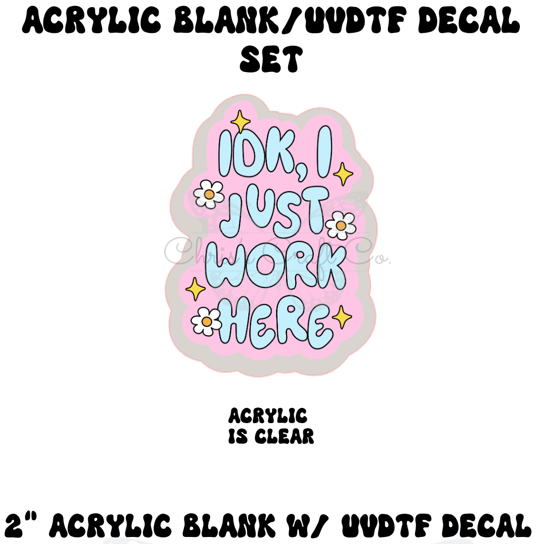 Clear acrylic charm with a funny wide-eyed blue character and pink text that says Idk I Just Work Here with blue hearts.
