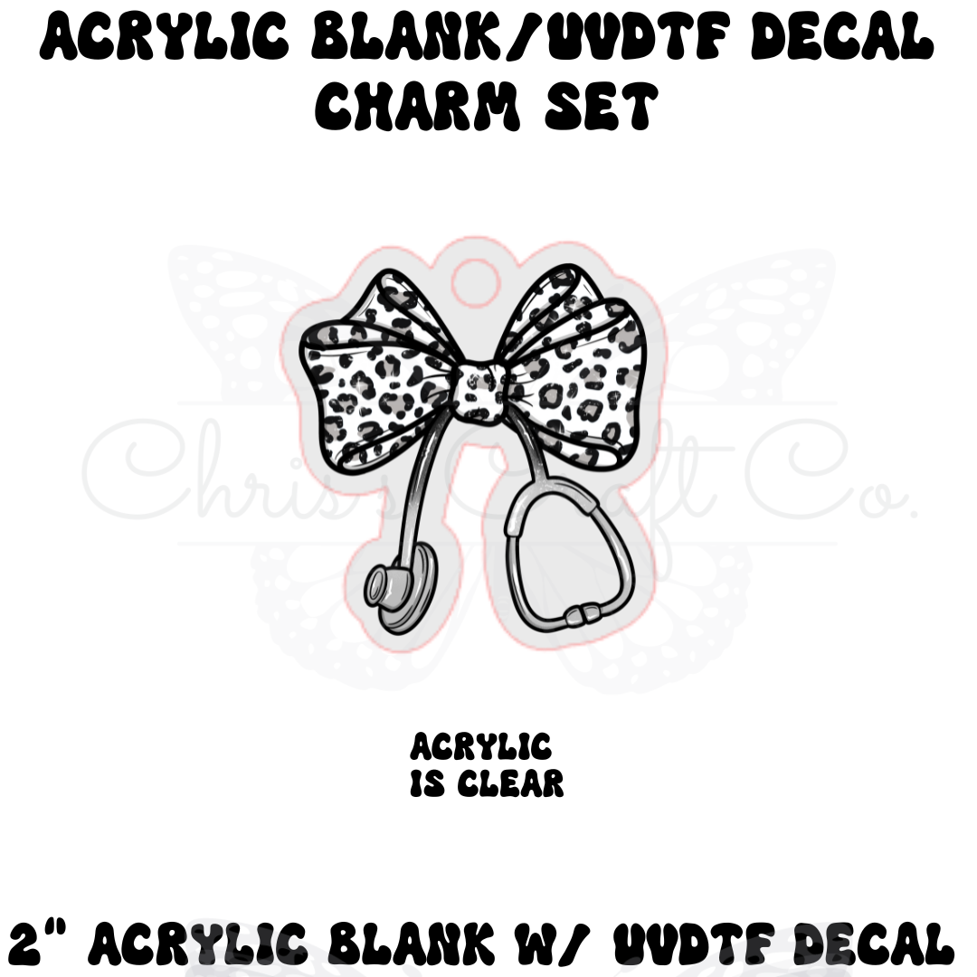 Acrylic blank charm set with leopard print bow and clear acrylic base on a white background