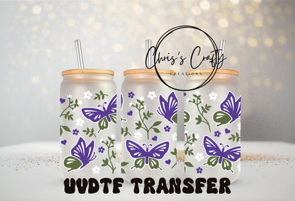 A set of two glass mugs with purple butterfly patterns and floral designs, displayed with a 'UVDTF Transfer' text overlay.