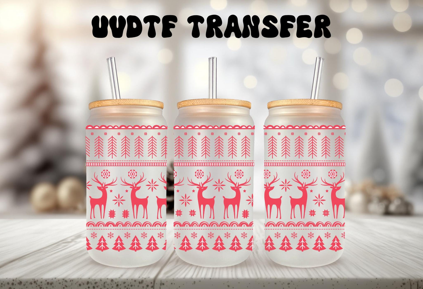 Three frosted mason jars with a red and white Christmas-themed design, featuring reindeer and snowflakes, are displayed on a wooden surface.