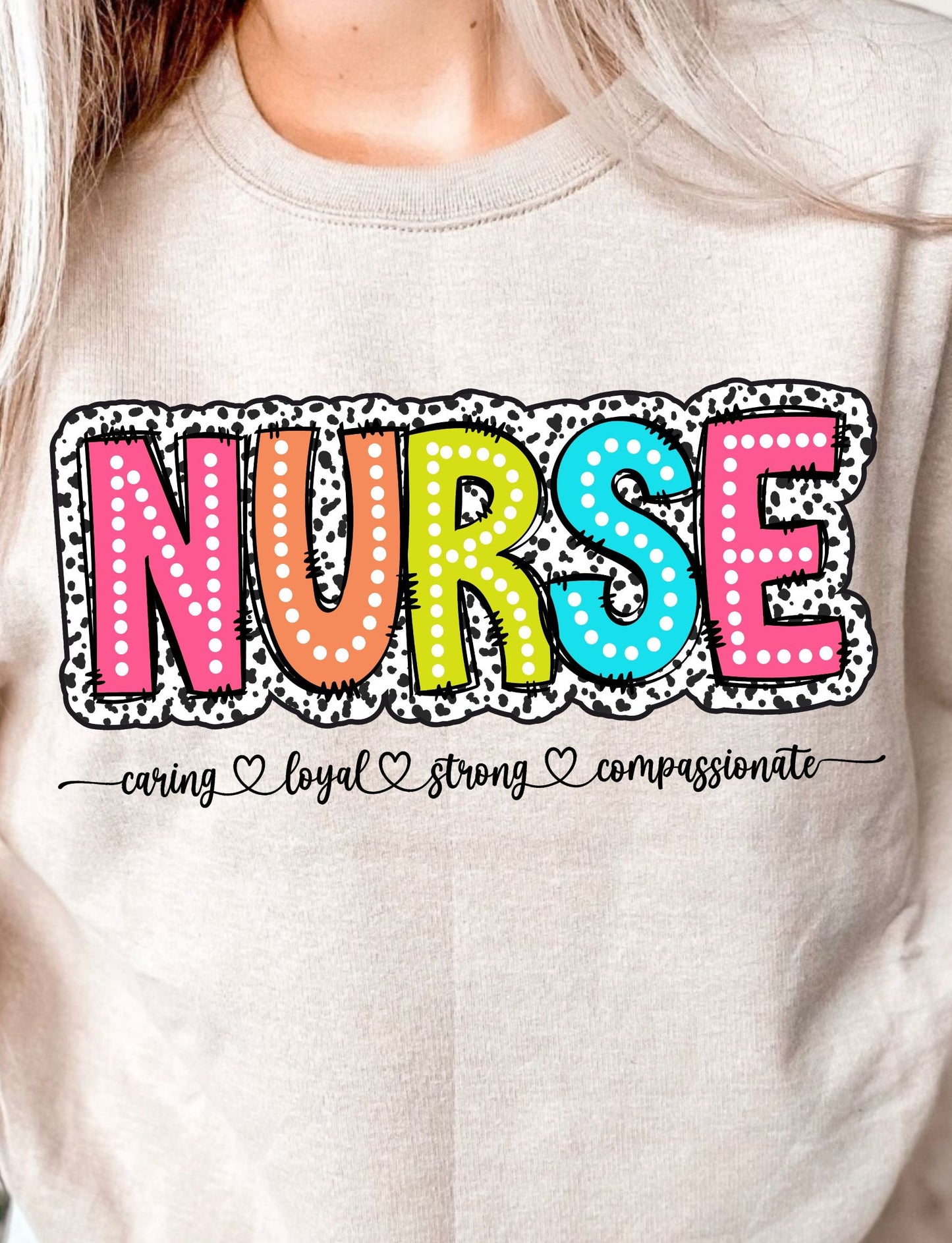 DTF shirt transfer with the word NURSE in dalmatian and polka dot patterns with caring loyal strong compassionate script below
